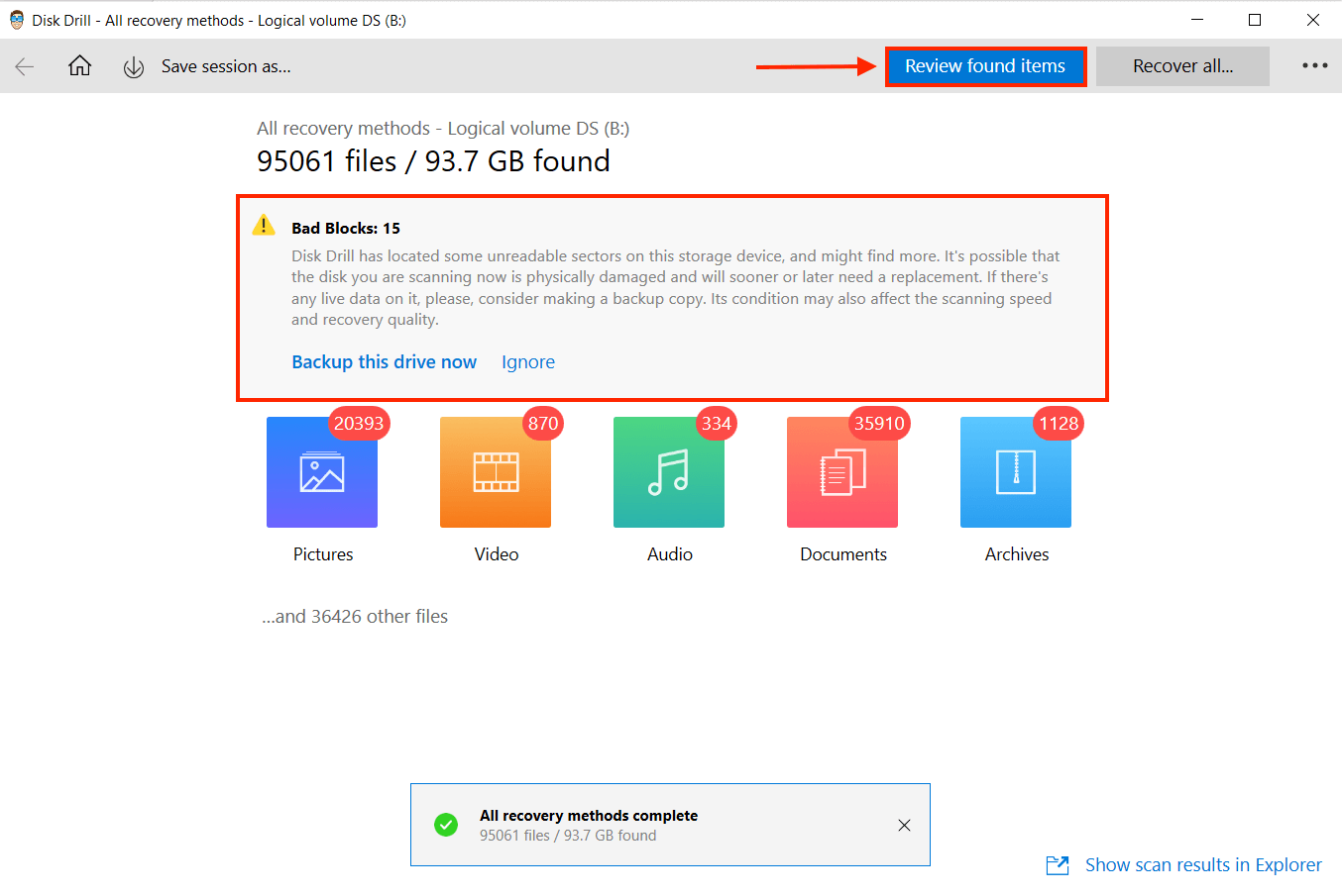 Disk drill window with a pointer towards Review found items button and an outline around the warning for bad blocks