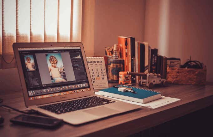 MacBook on someone\'s desk 